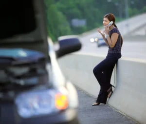 Woman calling for roadside assistance